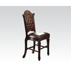 KD, Armless Chair Padded Seat & Back Cushion: PU with Nailhead Trim (Button Tufted Inside Backrest) Wooden Seat Apron with Molding Trim Wooden Tapered Leg & Footrest Supports: Floral Motif<br/><br/><b>Product Features</b><ul><li>Armless Chair</li><li>Padd