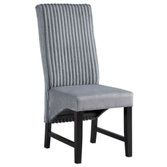 The Kini dining collection featuring a sophisticated black finish, exudes contemporary charm and elegance. Its sturdy construction and sleek lines provide a modern centerpiece for your dining area. Perfect for both intimate dinners and larger gatherings, 