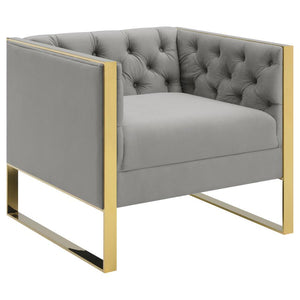 A blend of contrasting tones and materials will make this modern two-tone accent chair a mainstay in your home. It-'s upholstered in button tufted soft velvet in an elegant light grey finish that matches most any decor. A gold stainless steel base wraps a