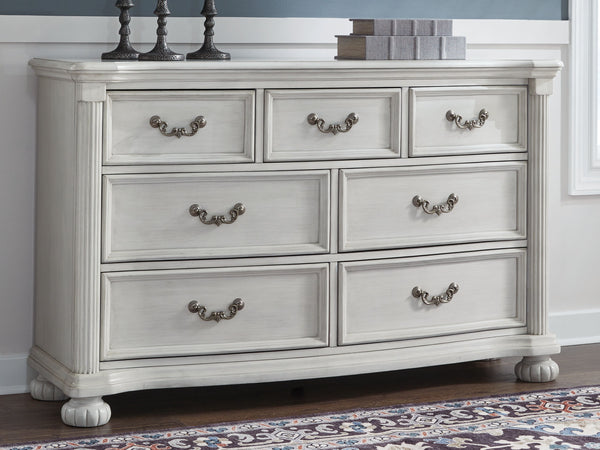  highlighted by a serpentine-shaped front with thick decorative moulding. Its drawers are pac