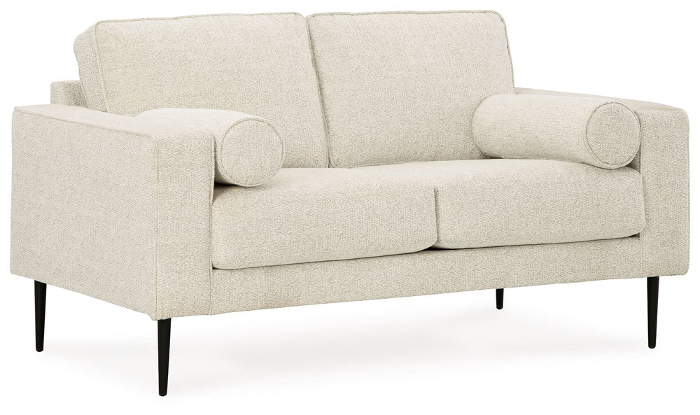 Simple comfort meets modern function in this loveseat. An apt addition to apartments and other small spaces, this slim-profiled piece welcomes you with its cozy character. A subtle chevron pattern on the cushions refreshes the classic neutral hue, elevati