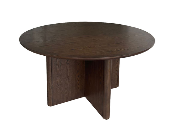 Bring refined elegance to your dining space with this sophisticated and contemporary dining group. Featuring a beautifully crafted round table with a rich woodgrain finish, it creates a warm and inviting atmosphere for meals and gatherings. The bold pedes