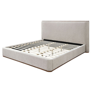 Adorned in elegant gray fabric, exudes contemporary charm with its full upholstered design and low profile footboard. Its soft, luxurious texture invites relaxation, while the minimalist aesthetic enhances any modern bedroom. The Orane collection is a per
