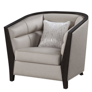 Create a homey and inviting casual space with Zemocryss Chair. The chair features tight back and loose seat cushion in beige fabric for a soft hue and cozy comfort. Pocket coil seating boasts good support and durability, with high shelter arms and tufted 