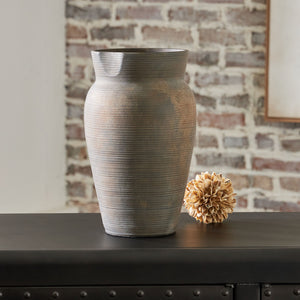  this stunning ceramic vase adds a beautiful timeworn quality to your home. Let it wow on its own