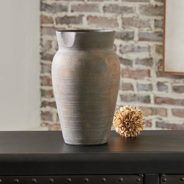  this stunning ceramic vase adds a beautiful timeworn quality to your home. Let it wow on its own