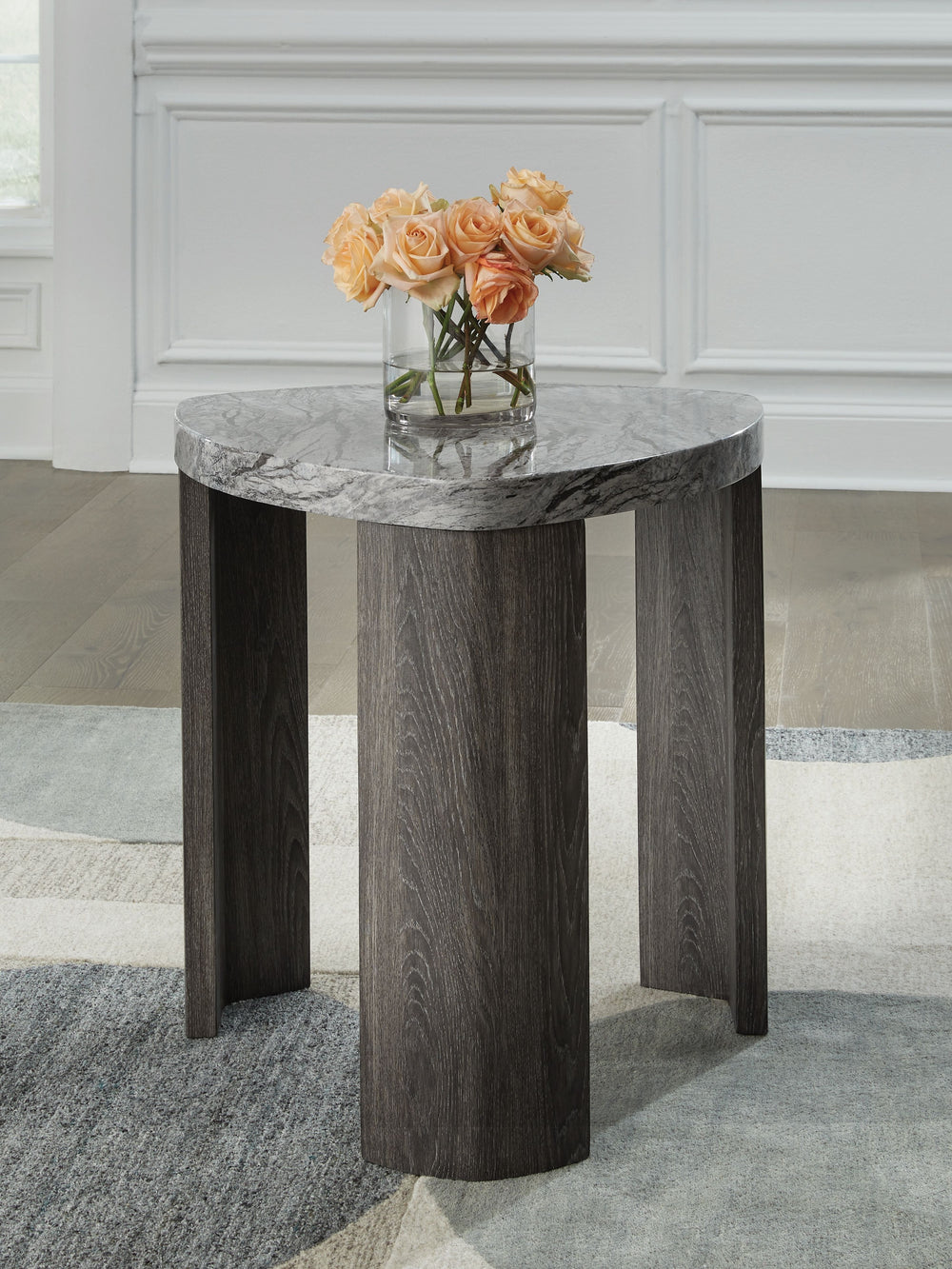 Striking contemporary form, meet canâ€™t-miss function. This end table pairs the look of faux gray marble with a weathered gray wood grain for a simply chic approach to monochromatic style. Perfect as a perch for remotes, a lamp or morning coffee, itâ€™s 