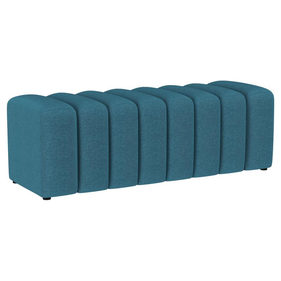 Introduce glam texture and dimension with a decorative upholstered bench. This modern creation features an undulating silhouette without arms or a back, offering sleek style and seating. Perfect for a sophisticated foyer or living room, it adds a pop of c