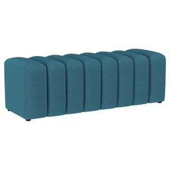Introduce glam texture and dimension with a decorative upholstered bench. This modern creation features an undulating silhouette without arms or a back, offering sleek style and seating. Perfect for a sophisticated foyer or living room, it adds a pop of c