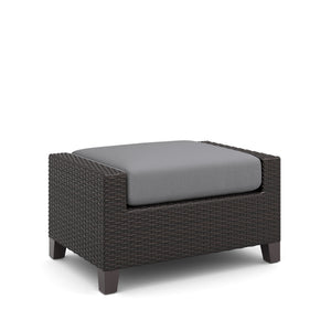The Skye Outdoor Ottoman Set in Gray includes 2 cushioned ottomans and is crafted with durable aluminum frames and a baked-on powder finish to ensure longevity and scratch resistance. The high-density HDPE wicker mimics the look of natural wicker while be