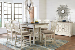 Unique two-tone finish with a combination of Oak and Acacia substrates combining a trendy textured antique white color with table and server tops finished in a textural weathered oak finish. Rectangular dining table features six convenient drawers for sto