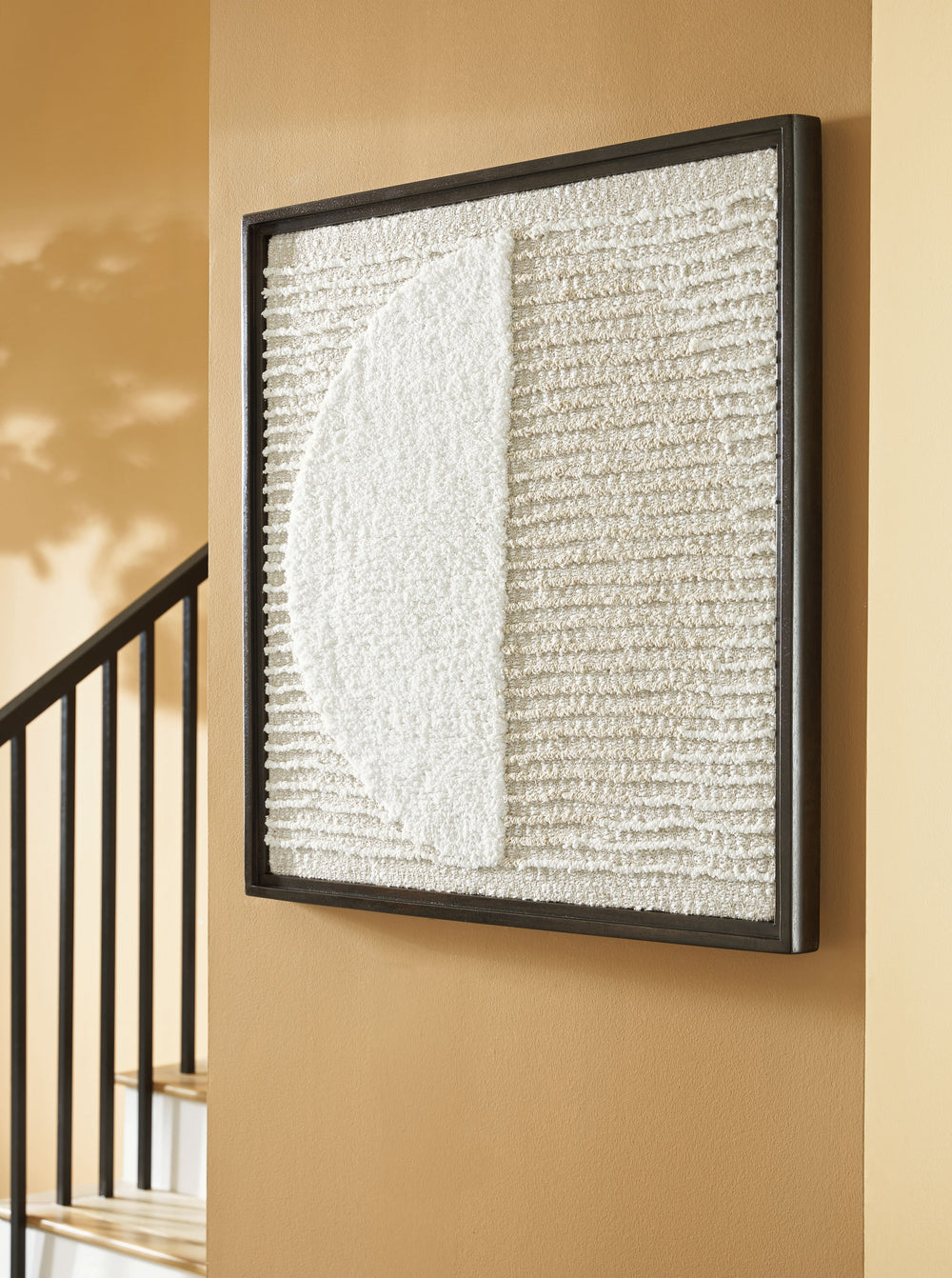 This wall decor is an inviting take on texture. Contrasting neutral hues add a chic flair to the woven geometric design. Stunning in its simplicity, this piece is a cozy addition to casual spaces.<br/><br/><b>Product Features</b><ul><li>Made with woven fa