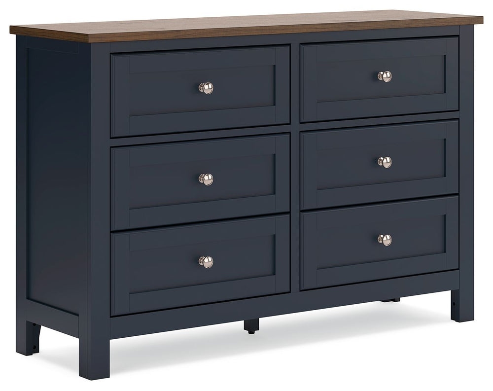 Add homespun charm to your restful retreat. A modern take on a timeless silhouette, this dresser pairs a dark slate blue finish with a light brown top. Drawer fronts and legs in a classic Shaker style bring an air of beautiful simplicity to the bedroom. W