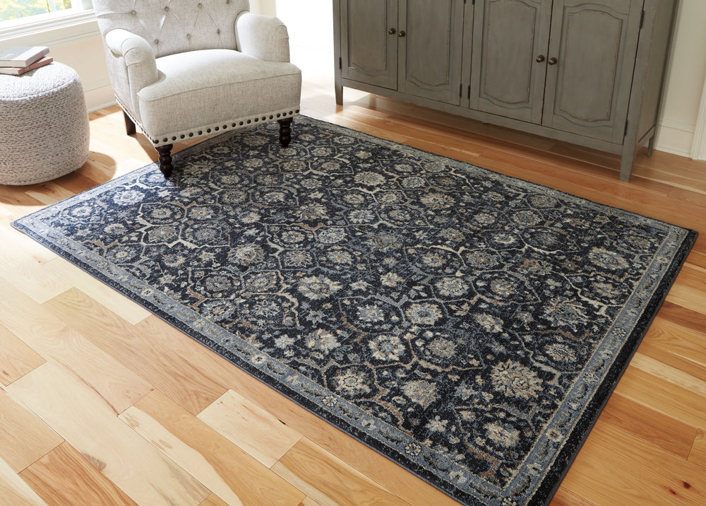 Inspired by traditional Persian designs, this accent rug is adorned with an artful floral motif. Its timeless pattern, rendered in a traditional palette, suits a range of interiors.<br/><br/><b>Product Features</b><ul><li>Made of polyester</li><li>Machine