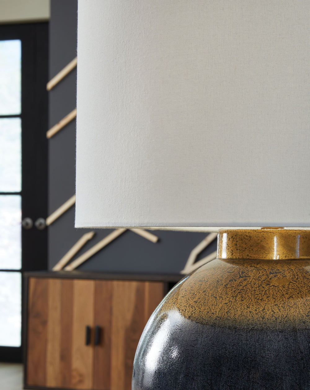 Effortlessly elevate your home-'s decor with the chic refinement of this table lamp. Its elegant blue and goldtone hues add quiet luxury to your living space, bedroom or office, casting a glow of sophistication and beauty.<br><br><b>Additional Dimensions<
