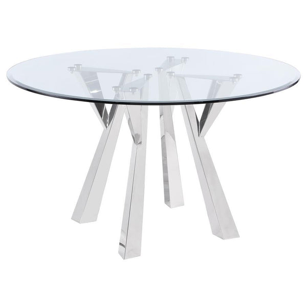 Center your sophisticated dining space on the impeccably designed Alaia round dining table. Instilling a sense of glamorous energy, the table boasts a geometric base design crafted in metal with rich angularity and elegance. Gleaming chrome finish plays u