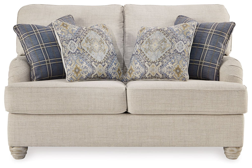 Donâ€™t be shyâ€”take a seat on this farmhouse-style loveseat. Dressed in a modern and relaxed linen-weave upholstery, itâ€™s a luxurious complement to rustic accents with its light and airy palette and elegantly turned feet. Adorned with the plaid and pa