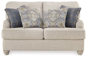 Donâ€™t be shyâ€”take a seat on this farmhouse-style loveseat. Dressed in a modern and relaxed linen-weave upholstery, itâ€™s a luxurious complement to rustic accents with its light and airy palette and elegantly turned feet. Adorned with the plaid and pa