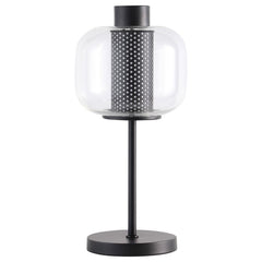 Steeped in vintage inspirations, this modern industrial table lamp is a charming choice for your nightstand or side table. Inside, a 9-watt LED bulb ensures energy efficiency and bright illumination. A metal mesh column in chic black creates depth and tex