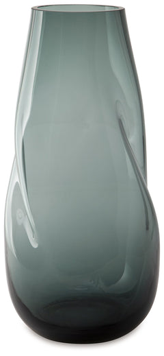 Sleek. Contemporary. Chic. This vase has an organic sense of movement, recalling seaside aesthetics with its teal glass. A stunning solo accent, it also acts as a beautiful vessel for florals and other decorative fillers. And the vase is safe for outdoor 