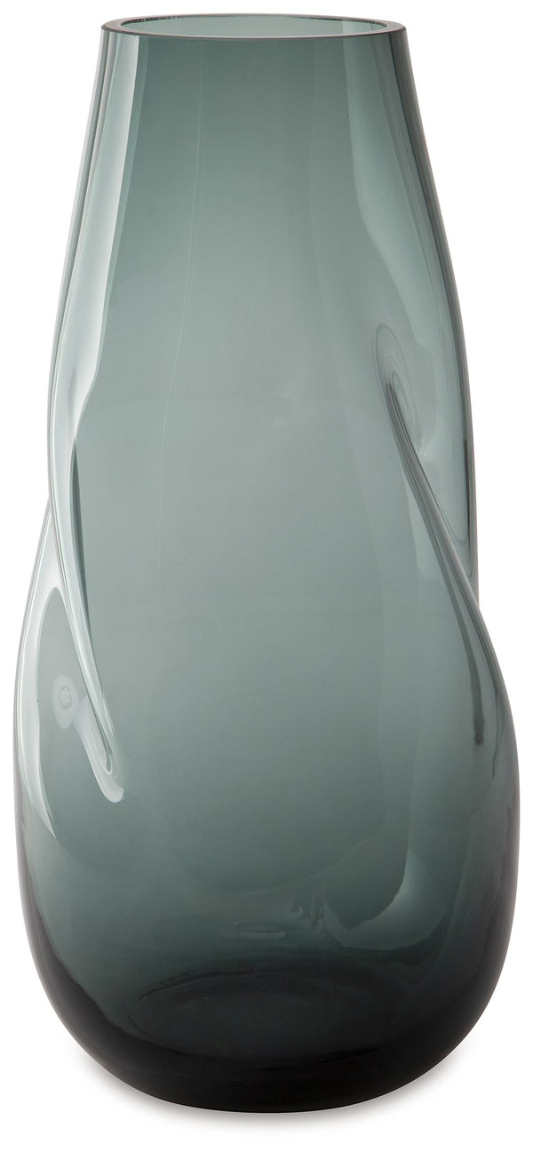 Sleek. Contemporary. Chic. This vase has an organic sense of movement, recalling seaside aesthetics with its teal glass. A stunning solo accent, it also acts as a beautiful vessel for florals and other decorative fillers. And the vase is safe for outdoor 