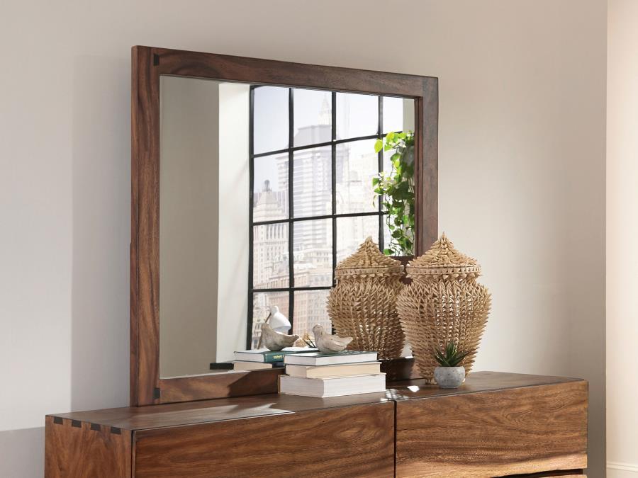 Create a stylish setting for your everyday grooming routine. This strong, sturdy mirror is crafted for quality. Its frame boasts a pleasing finish of smokey walnut. Its large size makes it ideal for a master bedroom. Affix this mirror to a matching dresse