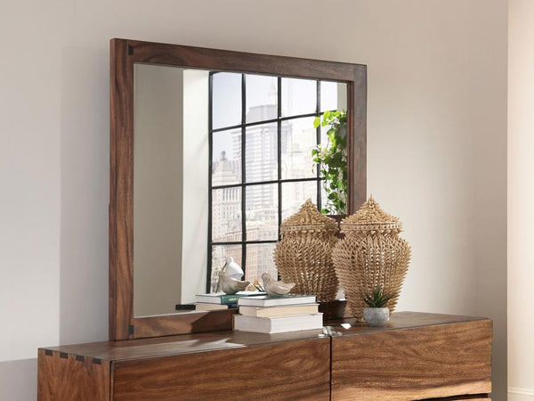  sturdy mirror is crafted for quality. Its frame boasts a pleasing finish of smokey walnut. Its large size makes it ideal for a master bedroom. Affix this mirror to a matching dresse