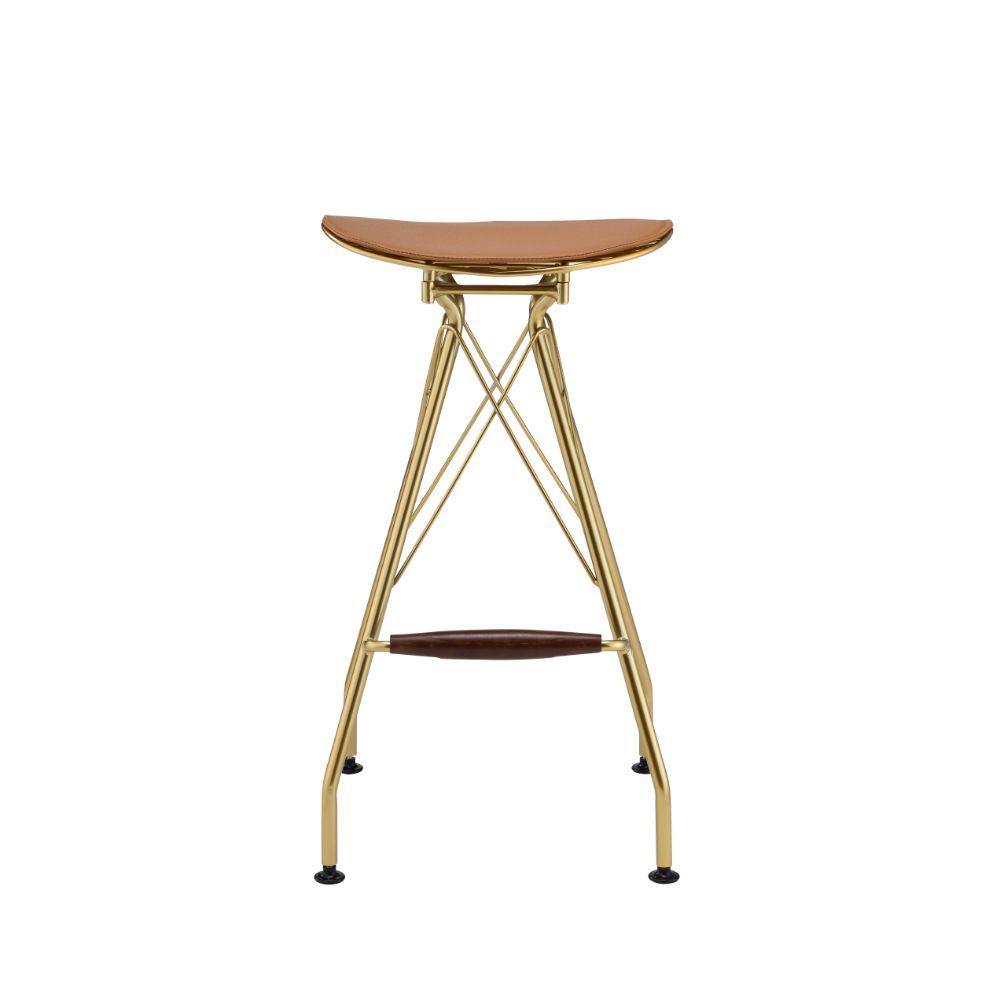 Fusing a simple modern design with an industrial color scheme, this Dragea bar stool is the perfect choice for any kitchen island, breakfast bar, or pub table. It features a gold metal frame with whiskey faux leather seat cushion. A streamlined silhouette