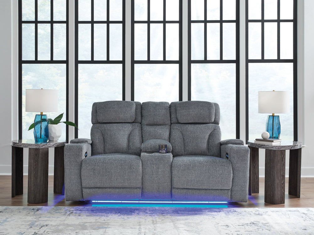 Chill-out time has never looked better. This power reclining loveseat-'s adjustable headrest ensures a perfect view of the TV no matter how far back you recline, while the extended ottoman takes your comfort to the next level. Handy charging features and 