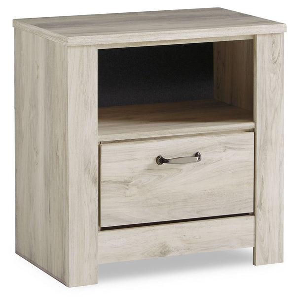 Your bedroom isnâ€™t just a room. Itâ€™s a canvas. Express your farmhouse style with this nightstand. Wispy white finish over replicated oak wood grain brightens up the space with charm. Brushed nickel-tone handles with black edging finesse the piece with
