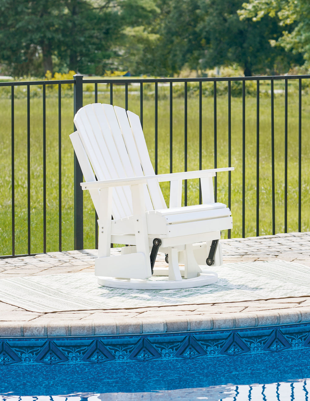 Drift away from everyday worries and into outdoor bliss with this swivel glider chair. Dressed in a bright white, the Adirondack-inspired design has a fresh feel. It weathers sunny summer days and cozy winter nights with durable MEGA-TUFFÂ® HDPE material.