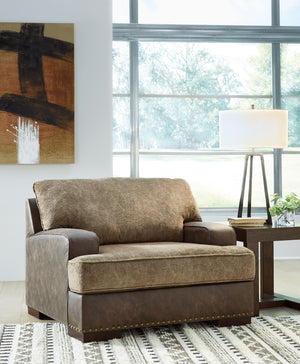  this chair is perfect for those who love the look of leather. Two textural tones provide twice the style and comfortâ€”and incorporate an added layer of visual interest. The piece is punctuated by a subtle band of nailhead 