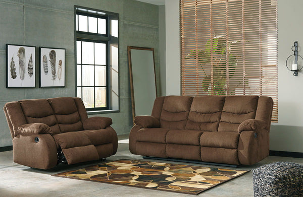 This reclining set puts the win in winning. Its waterfall back design and doubly plump pillow top arms team up with soft chenille fabric to go for the goal. Ample seating room makes the comfort possibilities endless. Sit back and relax. You wonâ€™t go wro