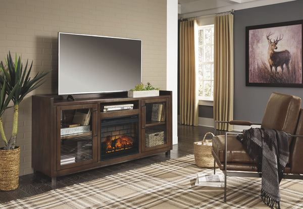 For fans of urban industrial design, this XL TV stand with fireplace insert clearly steals the show. Its blend of acacia veneer and wood is beautified with an oiled walnut-tone finish for a highly contemporary aesthetic with grainy, earthy character. Infu
