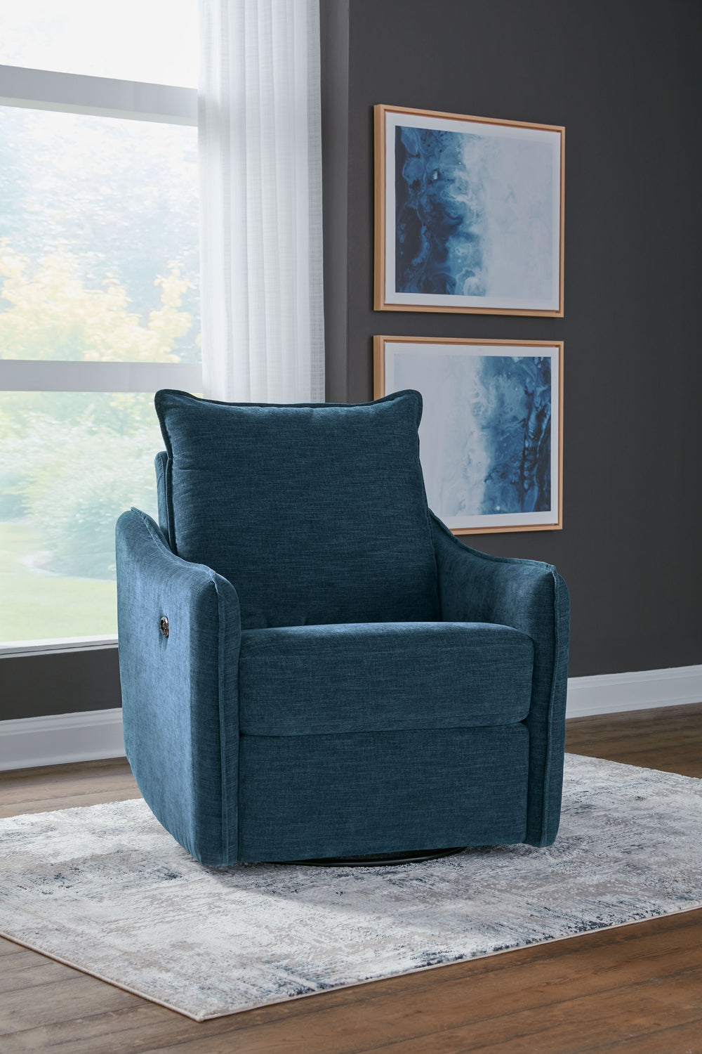 Elegance meets comfort. This swivel power recliner seamlessly blends style and practicality. Its sleek design, adorned with luxurious velvet upholstery, invites you to unwind. Whether catching up on your favorite show or chatting with guests, this chair i
