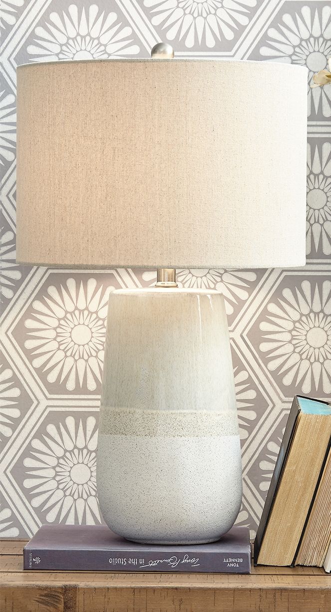 With a textured neutral glaze, this monochromatic table lamp brings thoughts of sun, surf and sand to your space. Turn coastal chic to the contemporary side with this transitional lamp.<br><br><b>Additional Dimensions</b><br><ul><li>Cord length: 96-"</li>