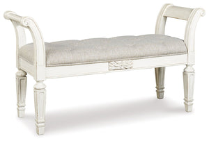 A classic to be cherished for years. This accent bench is a timeless treasure. Quality wood frame flaunts an antiqued white finish. Touches like the scrolled arms and floral applique give this piece so much character. Youâ€™ll love sitting on the cushiony