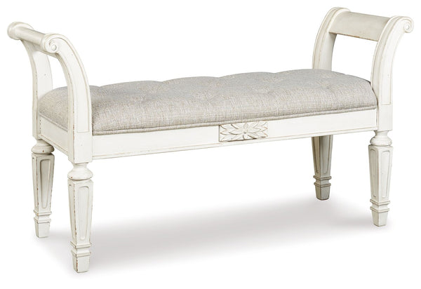A classic to be cherished for years. This accent bench is a timeless treasure. Quality wood frame flaunts an antiqued white finish. Touches like the scrolled arms and floral applique give this piece so much character. Youâ€™ll love sitting on the cushiony