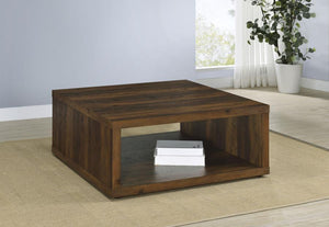  crafted from durable engineered wood with a dark pine wood-look finish. Its cube-inspired design features two open sides and a lower shelf for practical storage or display. The wood look lamin