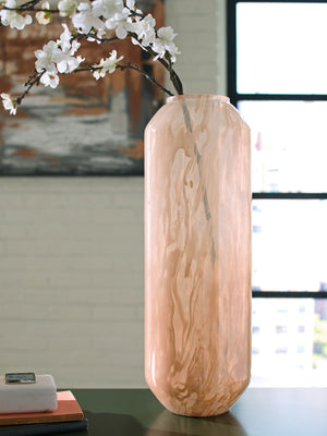  this vase has a chic sensibility that elevates your decor. Its contemporary silhouette is topped in a blush pink finish and flowing swirls