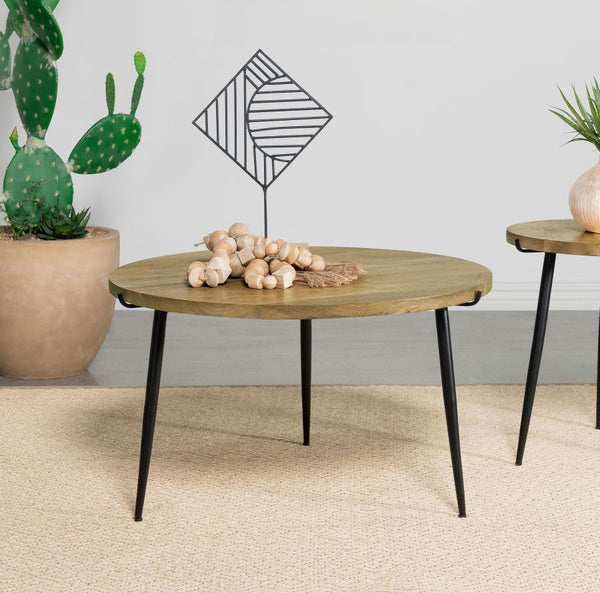  this round coffee table features a solid mango wood top in a natural finish