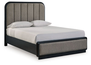 Inspired by art deco design, this softly shaped queen upholstered panel bed makes a lasting impression in a simply stunning way. Its magnificent curved silhouette is enhanced by a rich layered black finish on the textured wood grain surface. The channeled