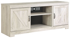 Express your farmhouse style with this TV stand. Its wispy white finish over replicated oak wood grain is a delightful change from the ordinary. Clean-lined, classic styling with barn door inspiration provides a country chic aesthetic thatâ€™s a breath of