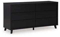 Sophisticated style for the savvy shopper. This dresser prioritizes affordable, on-trend design. Its subtle replicated texture recalls the natural beauty of wood, highlighting the slatted styling. And a matte black finish savvily suits different approache