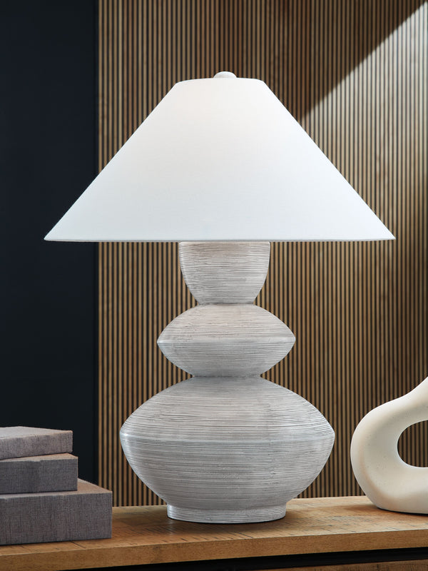  this triple gourd table lamp lightens the mood with a sense of ease and organic style. A distressed white finish adds a layer of interest to the base. Use it in pairs for double the impact in a bedroom