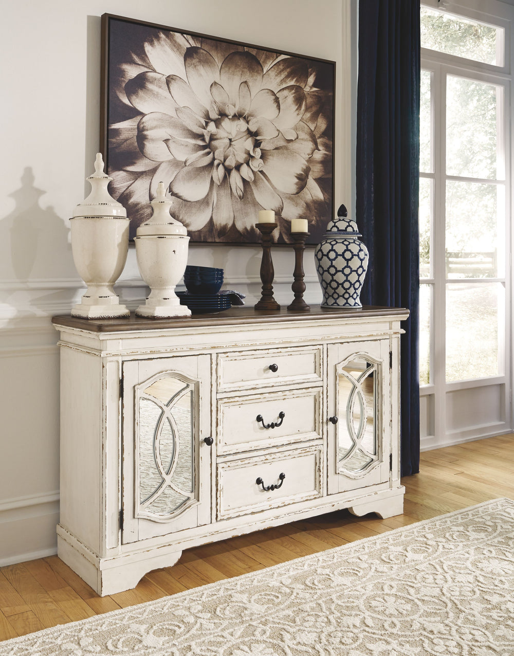 Serve up a French country-inspired feast for the eyes with this dining room server. Unique elements include cabinet storage beautified with decorative fretwork over mirrored glass and a doubly charming two-tone aesthetic pairing a chipped white with a dis
