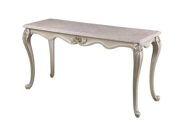 The Monique Royal Classic Console/Entry Table in champagne exudes heirloom-quality craftsmanship and timeless elegance. Expertly constructed from premium pine solids and adorned with durable polyurethane carvings, this table is lightweight, moisture-resis