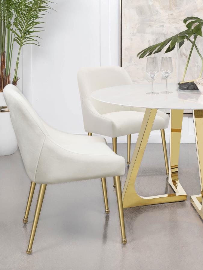 Cradle yourself in the embrace of opulence with this Italian style modern dining side chair, where comfort meets sophistication. Its plated metal legs, tapering into geometric spheres, create a foundation that-'s as sturdy as it is striking. The seat, a h