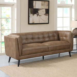  upholstered in a soft and smooth brown microfiber leather throughout its welt-trimmed and grid tufted seats and cushions. Plush and inviting w