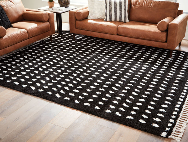  this rug adds sophistication to any space without sacrificing comfort or durability. Finished with a braided tassel edge completing the design